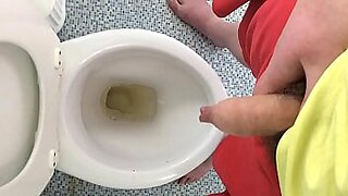 pissing on toilet